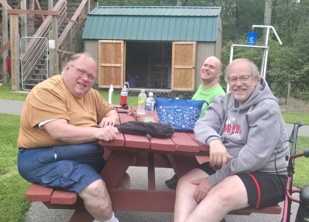 Alee Services community outing at an outdoor table.