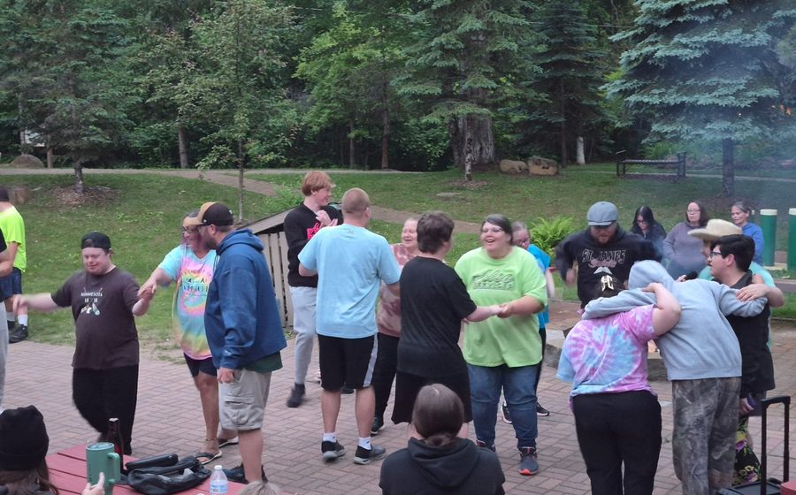 Alee Services group photo showing people together indoors.